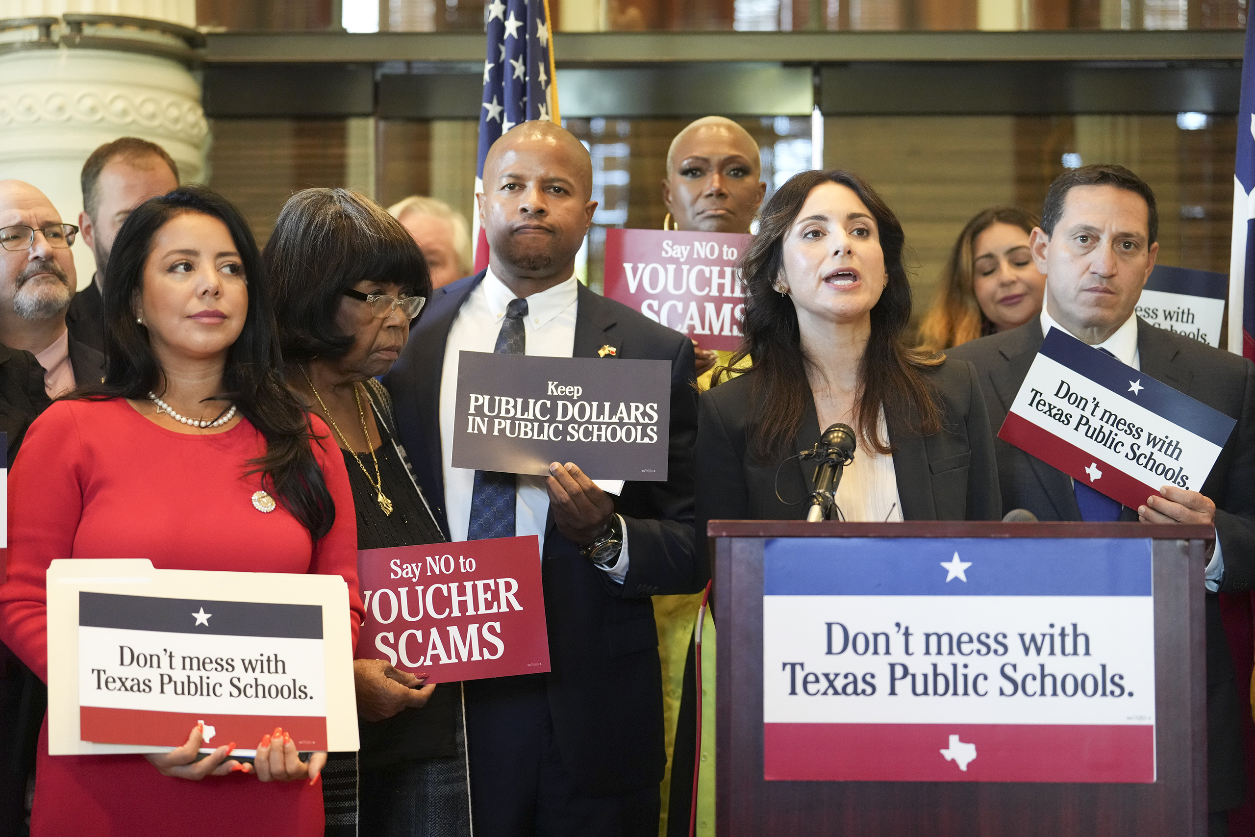Hinojosa (at the podium) speaks against school vouchers at a press conference prior to the start of the 3rd-called special session of the 88th Legislature on October 2, 2023.