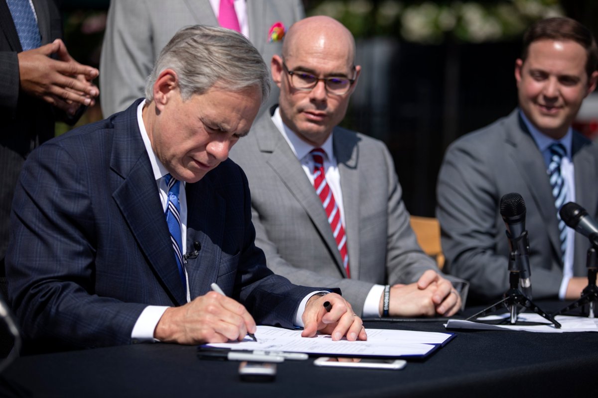 Gov. Greg Abbott signed Senate Bill 2 to limit property tax growth during a Wednesday press conference at Wally's Burger Express in Austin.