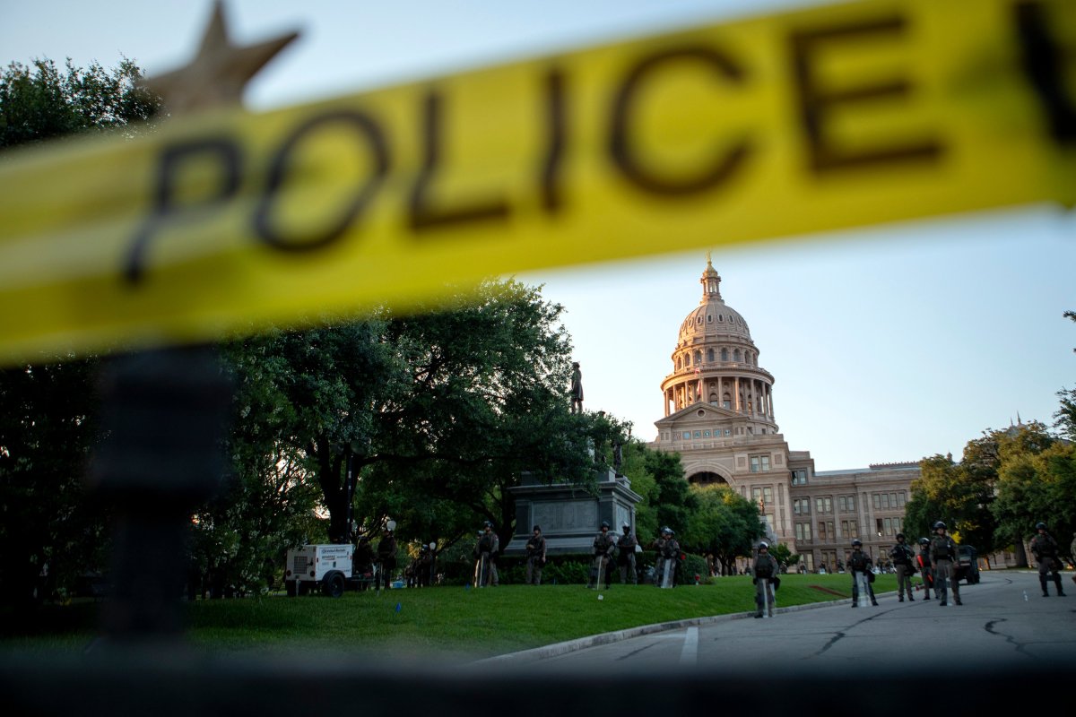 State troopers stand guard at the state Capitol grounds to prevent demonstrators from entering during a protest over the death of George Floyd.
