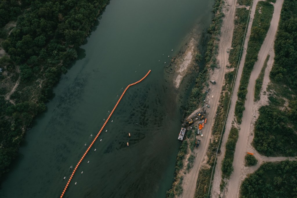 A string of buoys is deployed to prevent migrants from swimming across the Rio Grande in Eagle Pass on July 13, 2023.