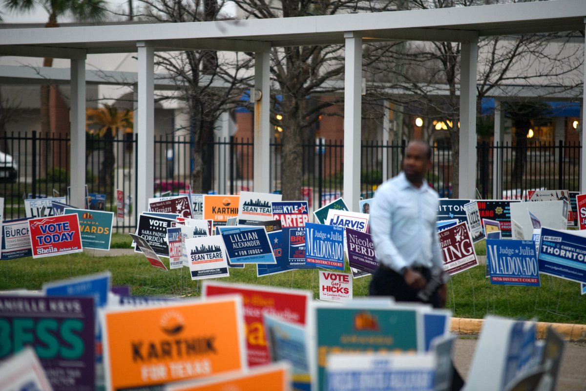 Election signs line the perimeter of the Metropolitan Multi-Service Center in Houston on March 5, 2024.