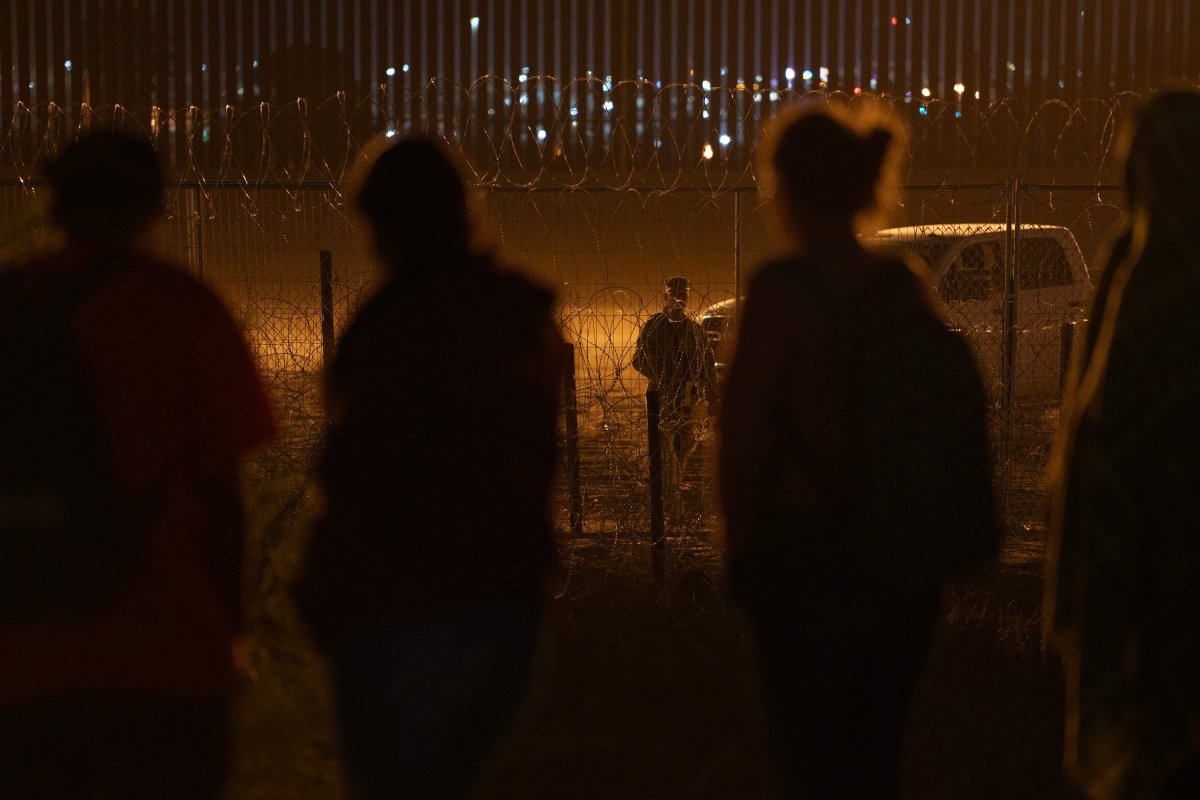 A Texas National Guard soldier stands guard next to concertina wire along the U.S.-Mexico border in El Paso, as seen from Ciudad Juárez, Mexico, on May 27, 2024.