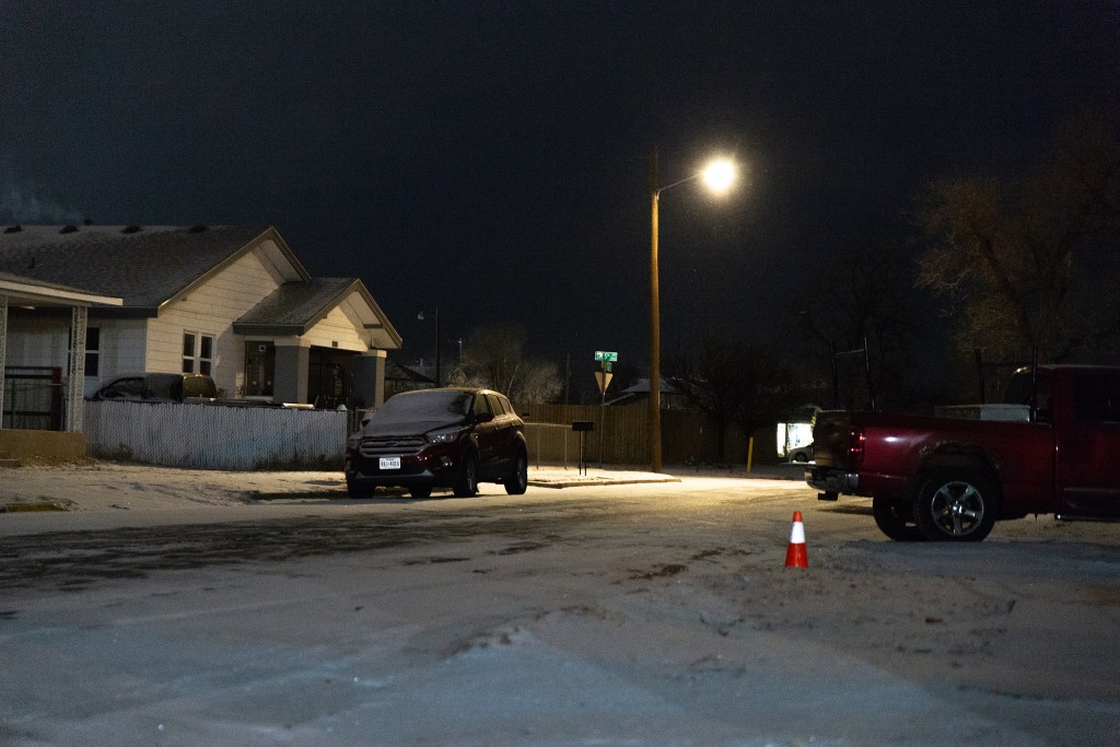 Snow began to accumulate on neighborhood streets in Amarillo on Friday evening.