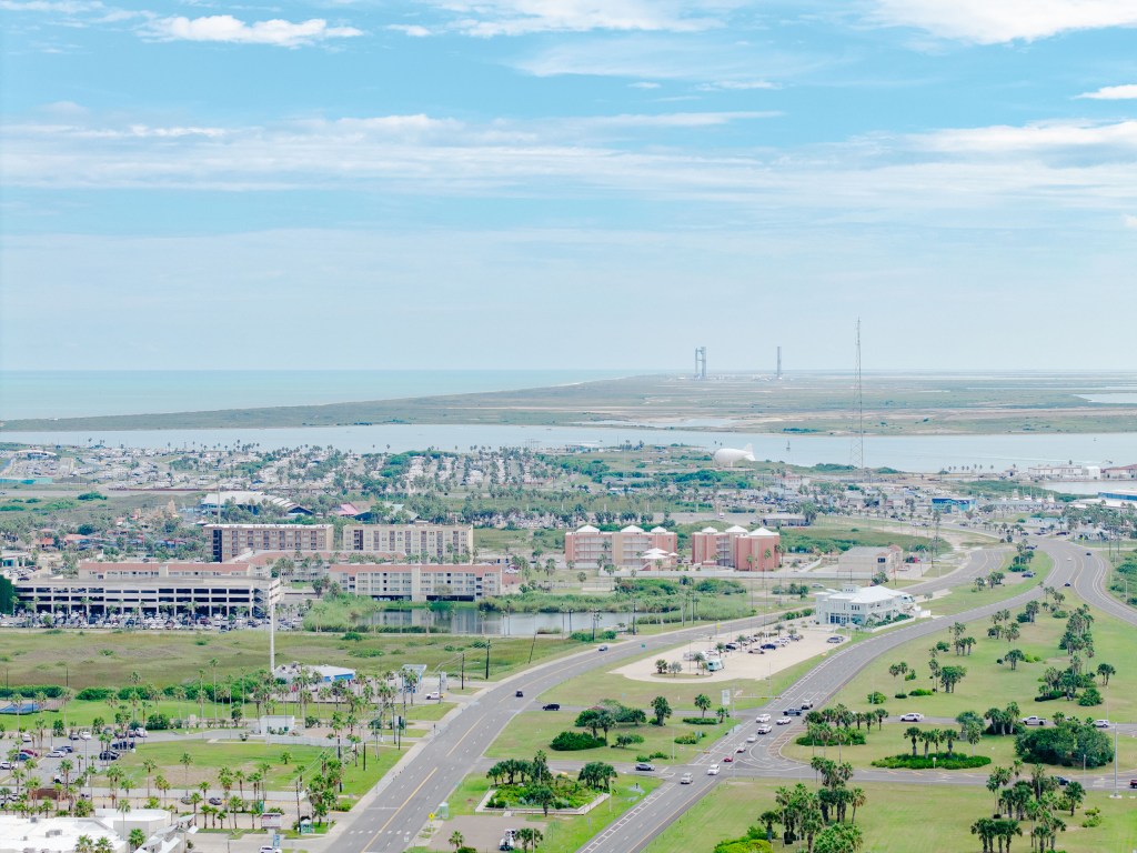 The SpaceX Starship on its launchpad in the distance beyond South Padre Island on Aug. 24, 2025.