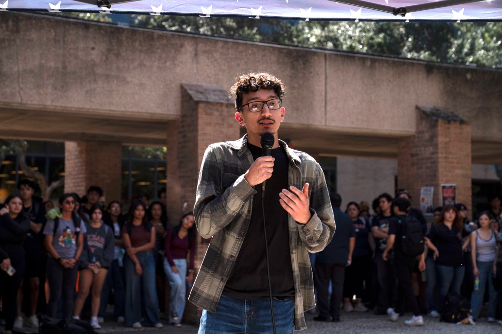 Luis Valdez, who voted for President Trump, speaks with former U.S. Rep. Mayra Flores, R-Texas, at The University of Texas Rio Grande Valley in Edinburg, Texas on October 28, 2025. Gabriel V. C&aacute;rdenas for The Texas Tribune