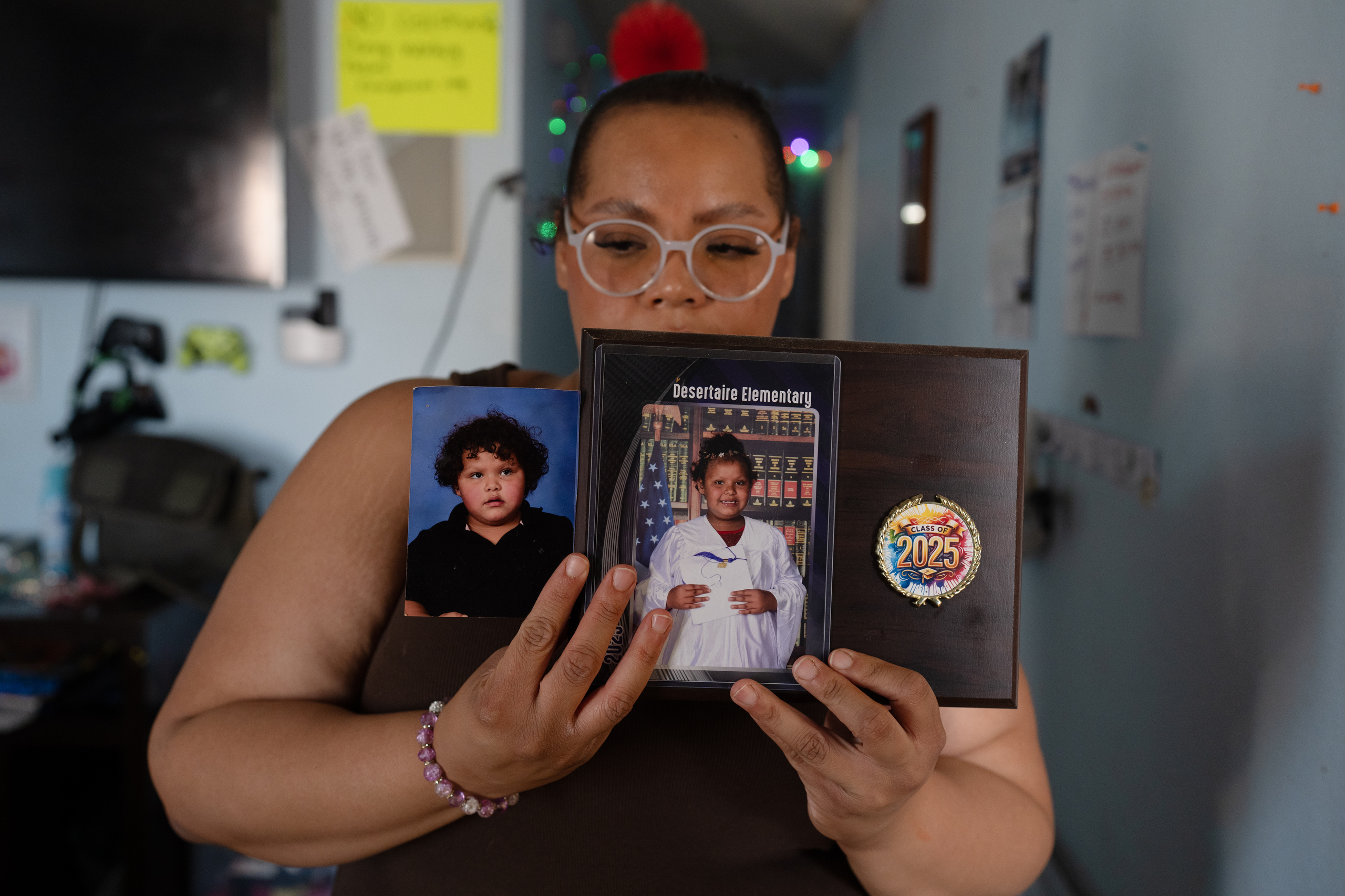 Gabrielle Jones-Radtke shows photos of her seven-year-old daughter Freyja, taken a year apart, in their home in El Paso, Texas on Saturday, February 28, 2026. Freyja suffers from Bardet-Biedl syndrome, which causes her excessive hunger due to a hormone imbalance, for which she is being treated with Imcivree, which isn&rsquo;t accessible in Texas because its viewed as gender-affirming care.