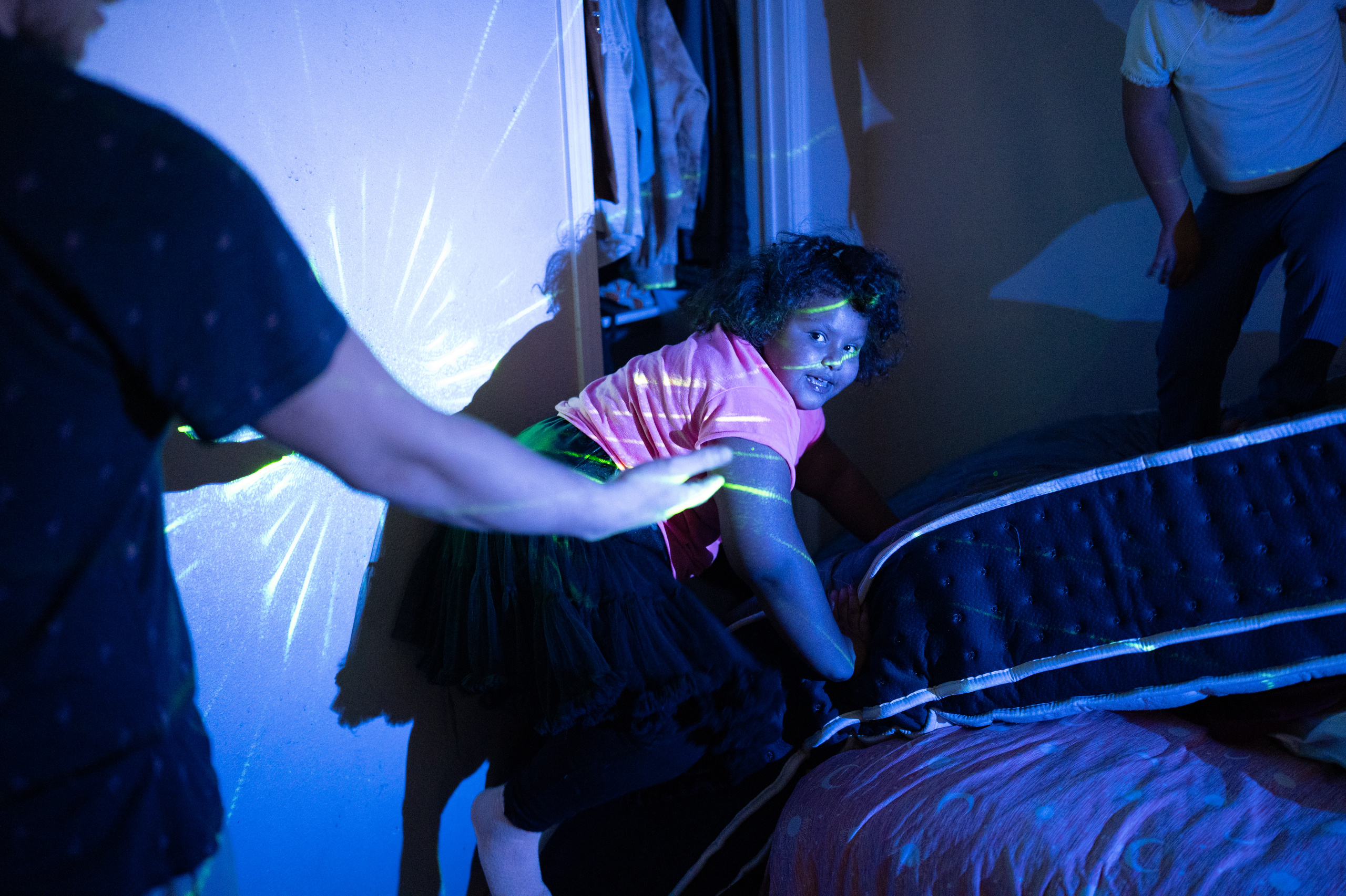 Seven-year-old Freyja Radtke, who suffers from Bardet-Biedl syndrome, a condition which causes excessive weight gain and hormonal imbalances, and in her particular case, an inability to control her own appetite, plays with her father, Sean Radtke, and sister Morrigan, 5, at the family&rsquo;s home on Saturday, February 28, 2026 in El Paso, Texas. Because Freyja is due for a medical test next week, she is forced to be off of Imcivree, the medication that controls her hormonal imbalances that lead to excessive hunger, until after the test.