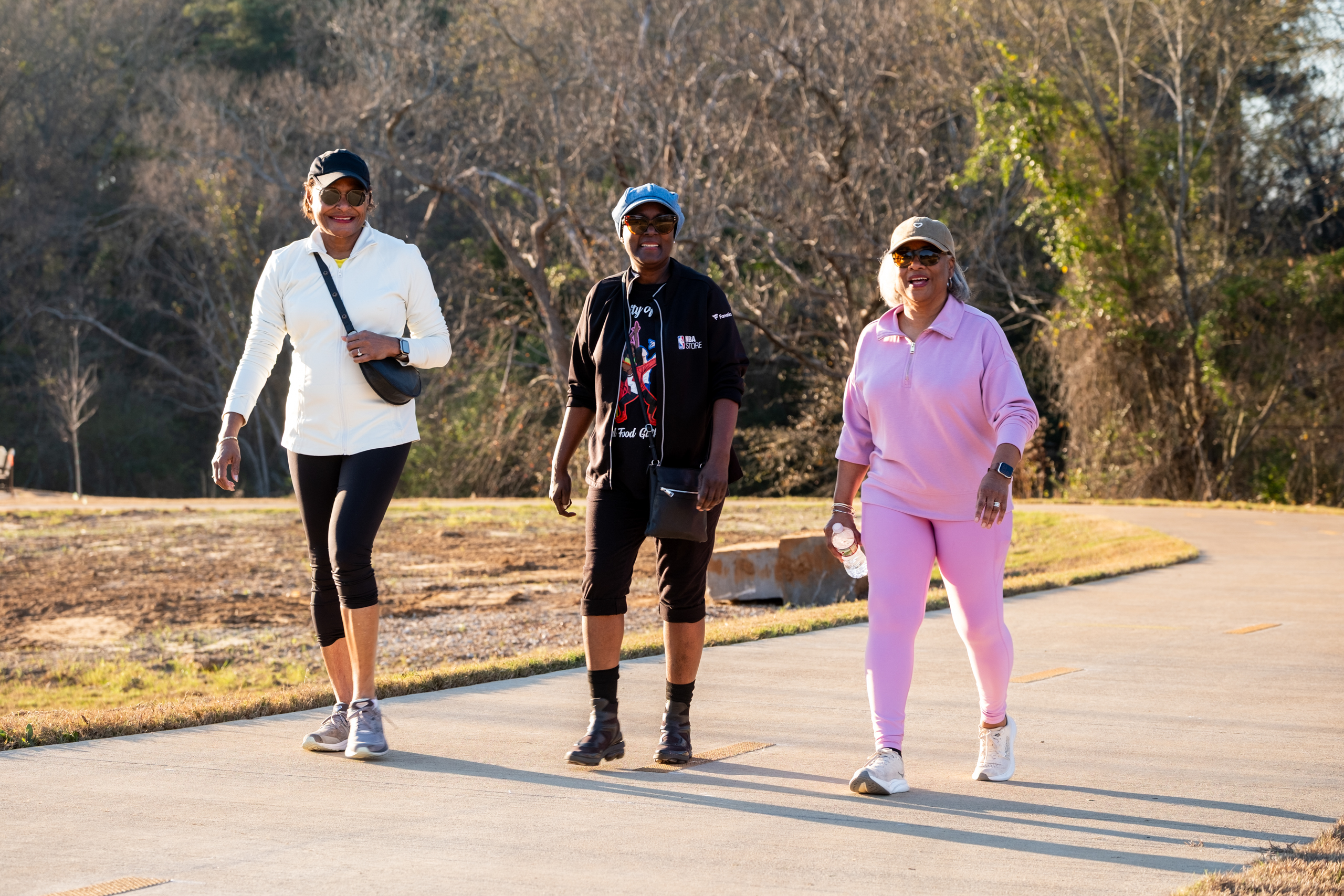 Gina Newsome, Stephanie Murphy, and Joyce Armstrong attend the ribbon cutting ceremony for a new section of the Legacy Trails walking trail on Jan. 6, in Tyler.