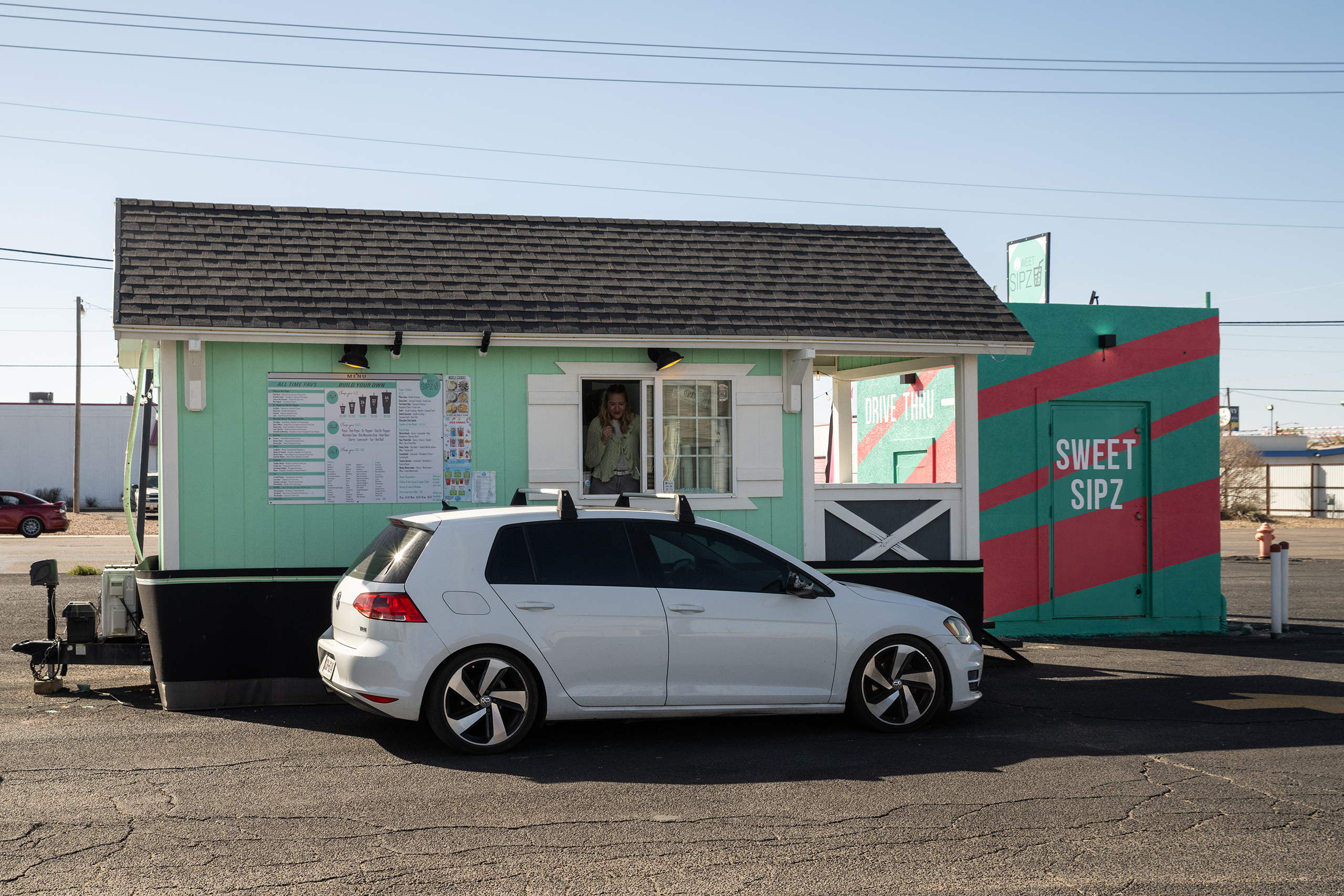 Slideshow: Sweet Sipz employee Marianne Hendricks takes a customer's order at the Sweet Sipz trailer in Amarillo on March 13, 2026.