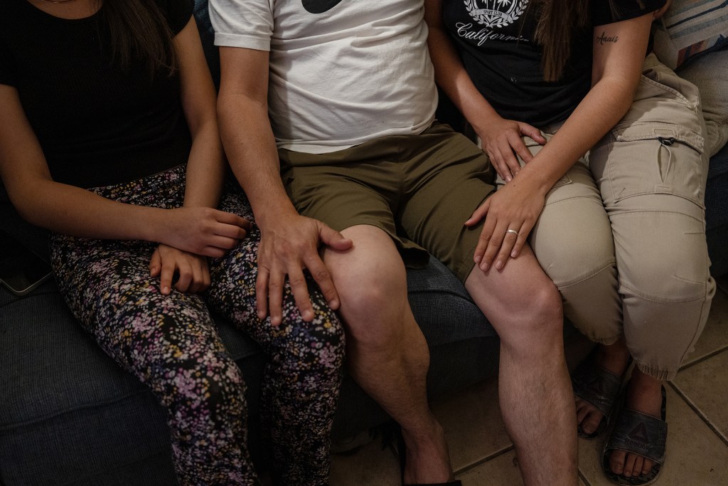 Jose, his wife Carolina, 31, and their 14-year-old daughter from Venezuela pose for an anonymous portrait in an apartment where they are staying with friends in Las Cruces, New Mexico on Sunday, April 12, 2026.