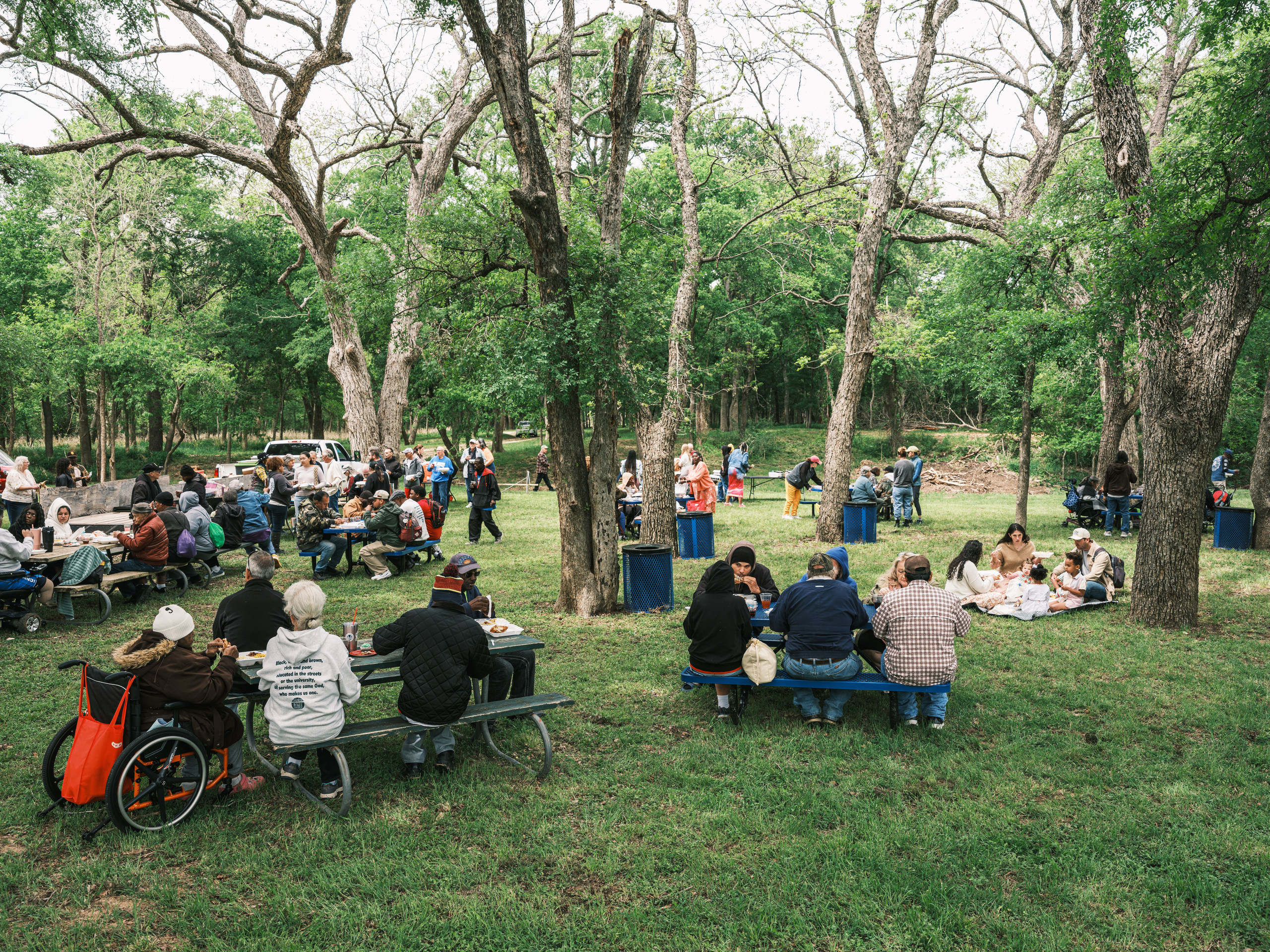 Congregants eat lunch after Church Under the Bridge’s Easter service along the Middle Bosque River west of Waco on Sunday.