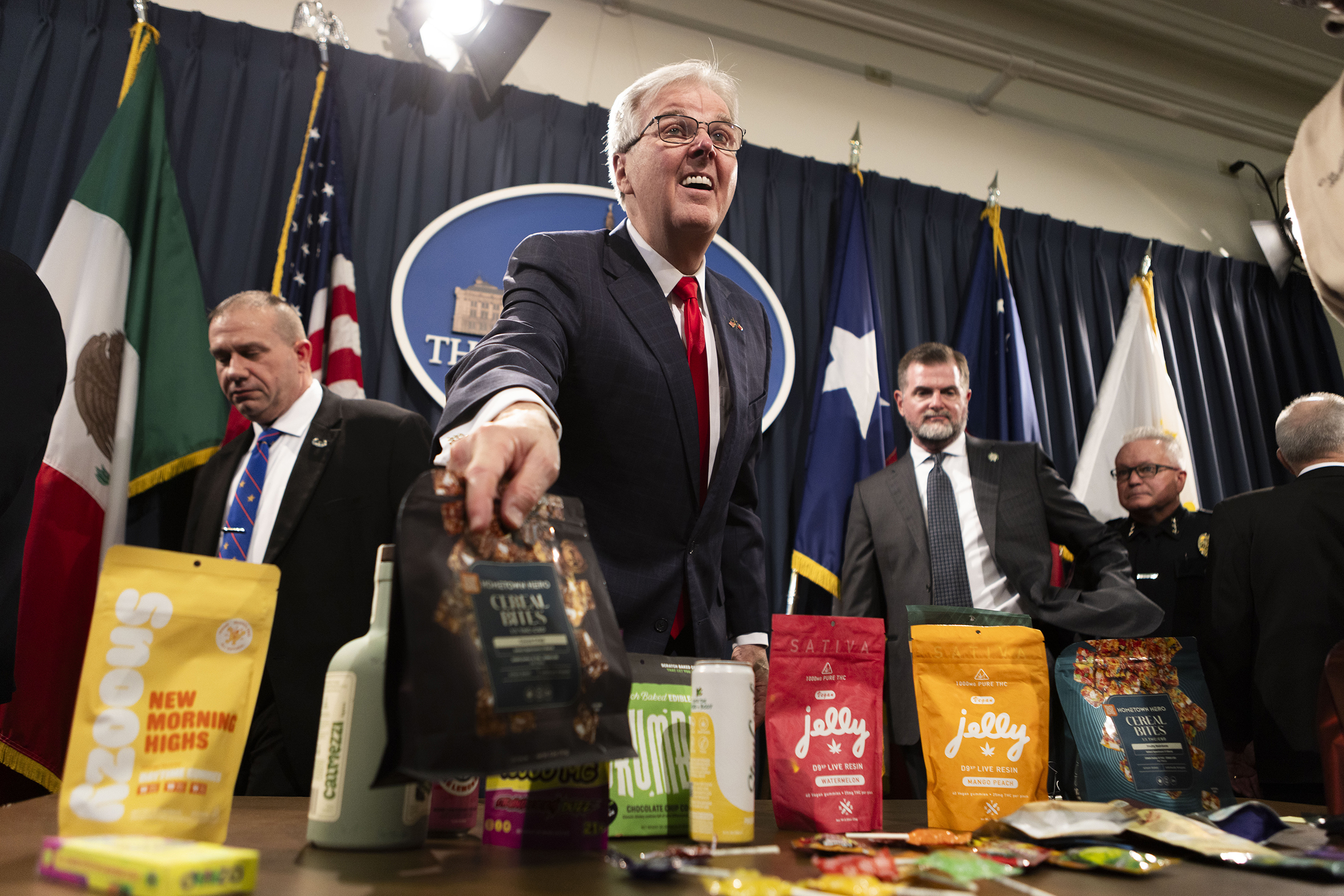 Lt. Gov. Dan Patrick shows off various THC and CBD products during a press conference in the Texas Capitol on May 28, 2025.