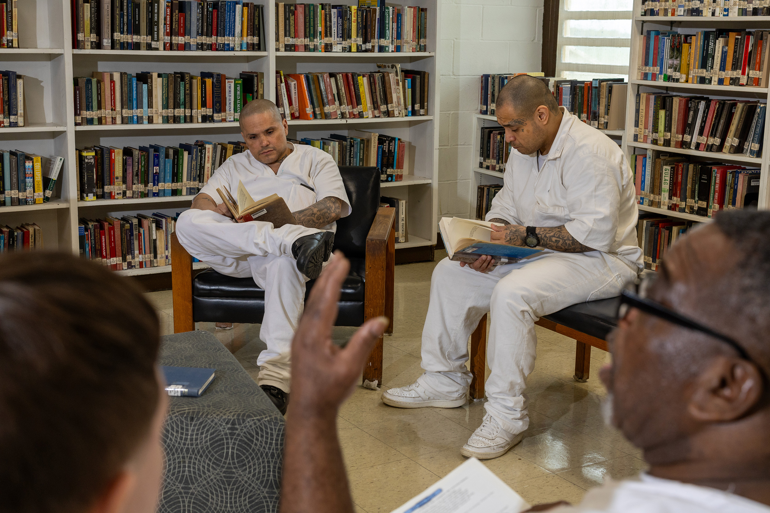 Inmates read books in the library of the TDCJ's Wynne Unit in Huntsville on May 21.