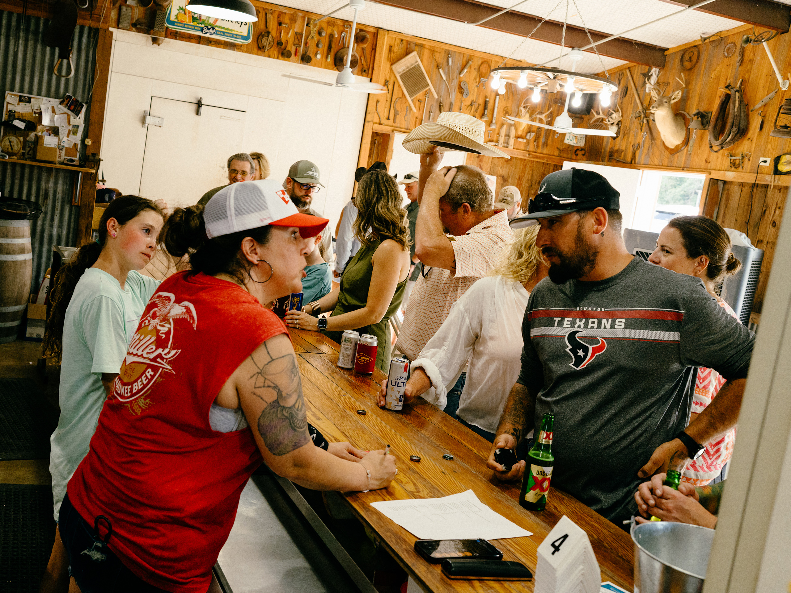 Community members fill Crider's Rodeo & Dancehall on a Friday evening for the weekly fish fry in Hunt, Texas on June 12, 2026.