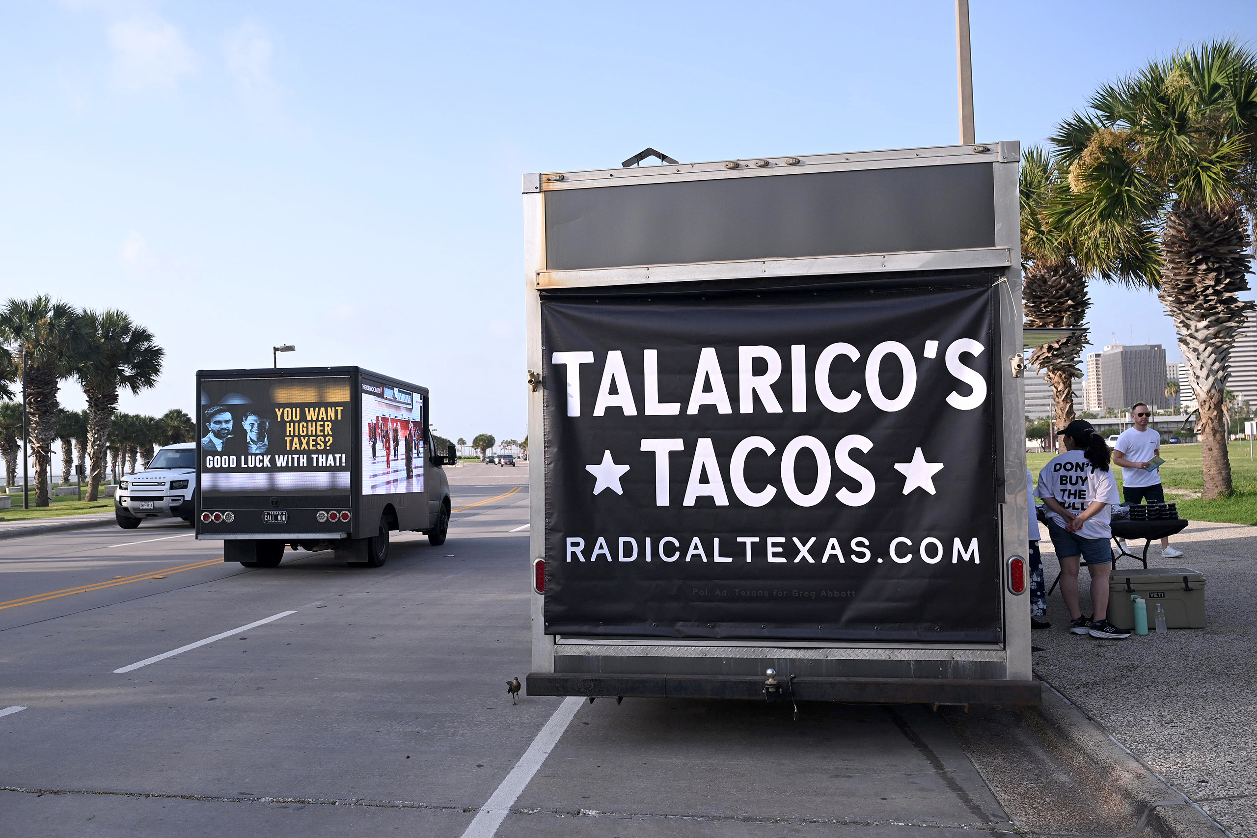 Volunteers with the Republican group Radical Texas pushed their message outside the convention by handing out free 