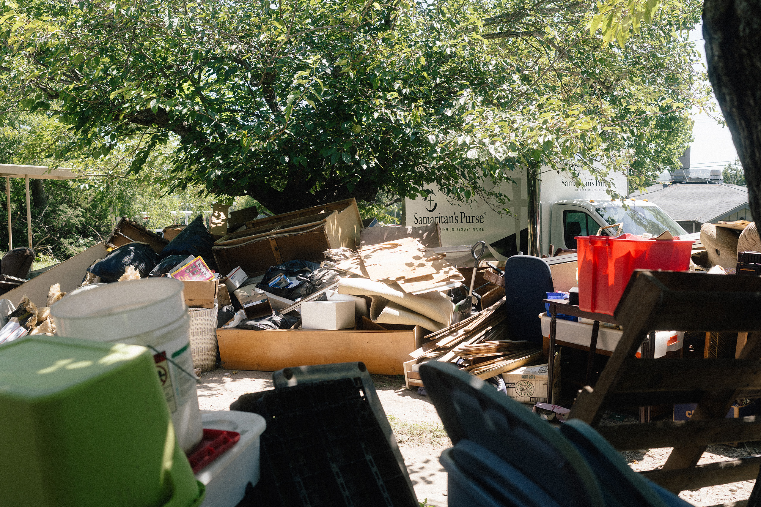 A Samaritan’s Purse truck parked outside of a home that is being gutted after being damaged by the July 16 flood, in Kerrville on July 28.
