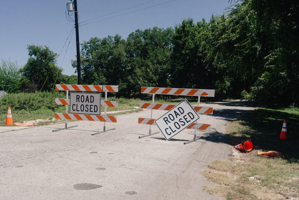 SLIDESHOW: A road closure on Arcadia Loop in Kerrville after the July 16 flood, on July 28, 2026.