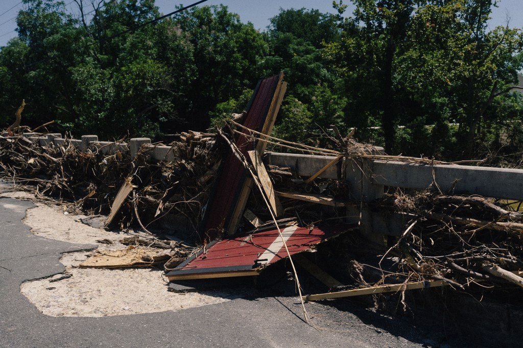 Almost two weeks after the July 16 flood, the Arcadia Loop bridge in Kerrville remains clogged with detritus.