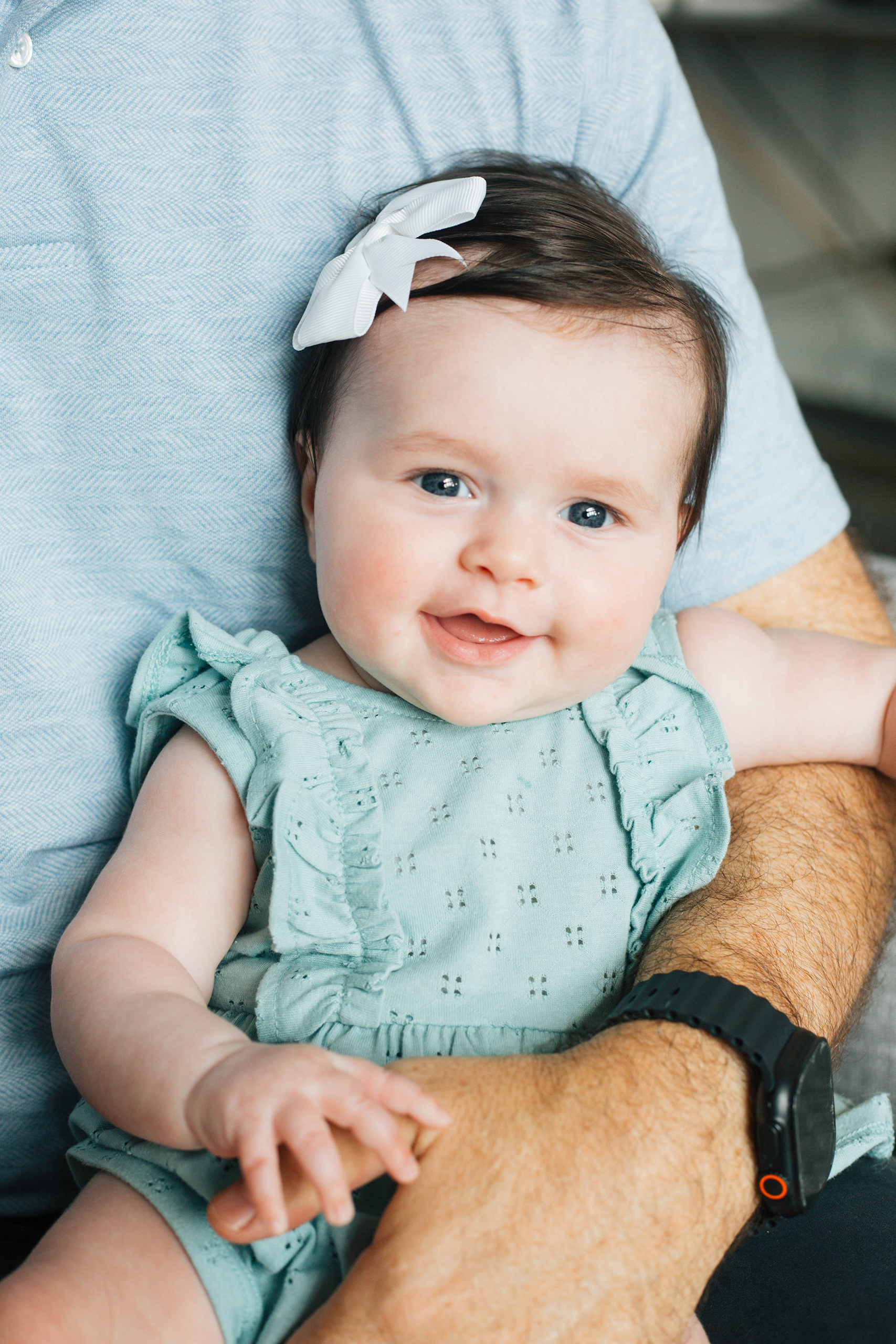 Eliana Stone is held by father Kevin Stone in their home on Aug. 26, 2026.