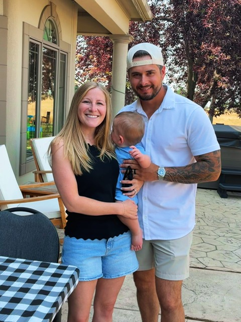 Parents Katie Blackwood and Seth Blackwood with son Bennet Blackwood in their home.