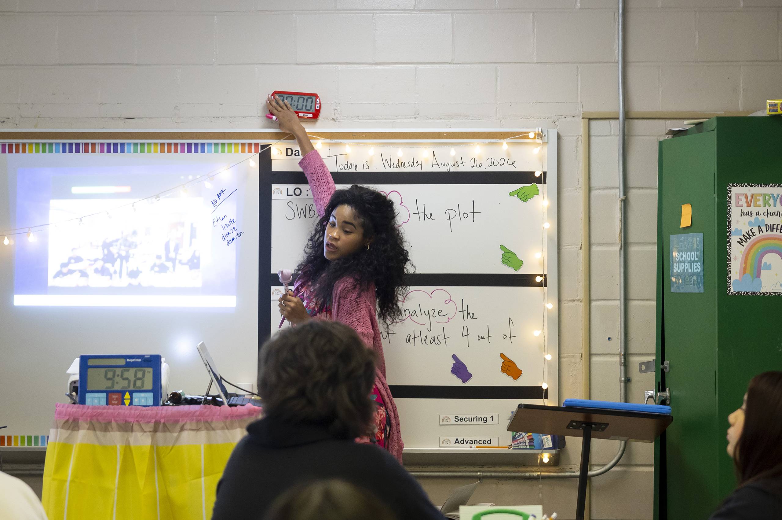 Eighth grade ELA teacher Shannon Cooper turns off a timer alarm after an instructional period at Fonville Middle School.