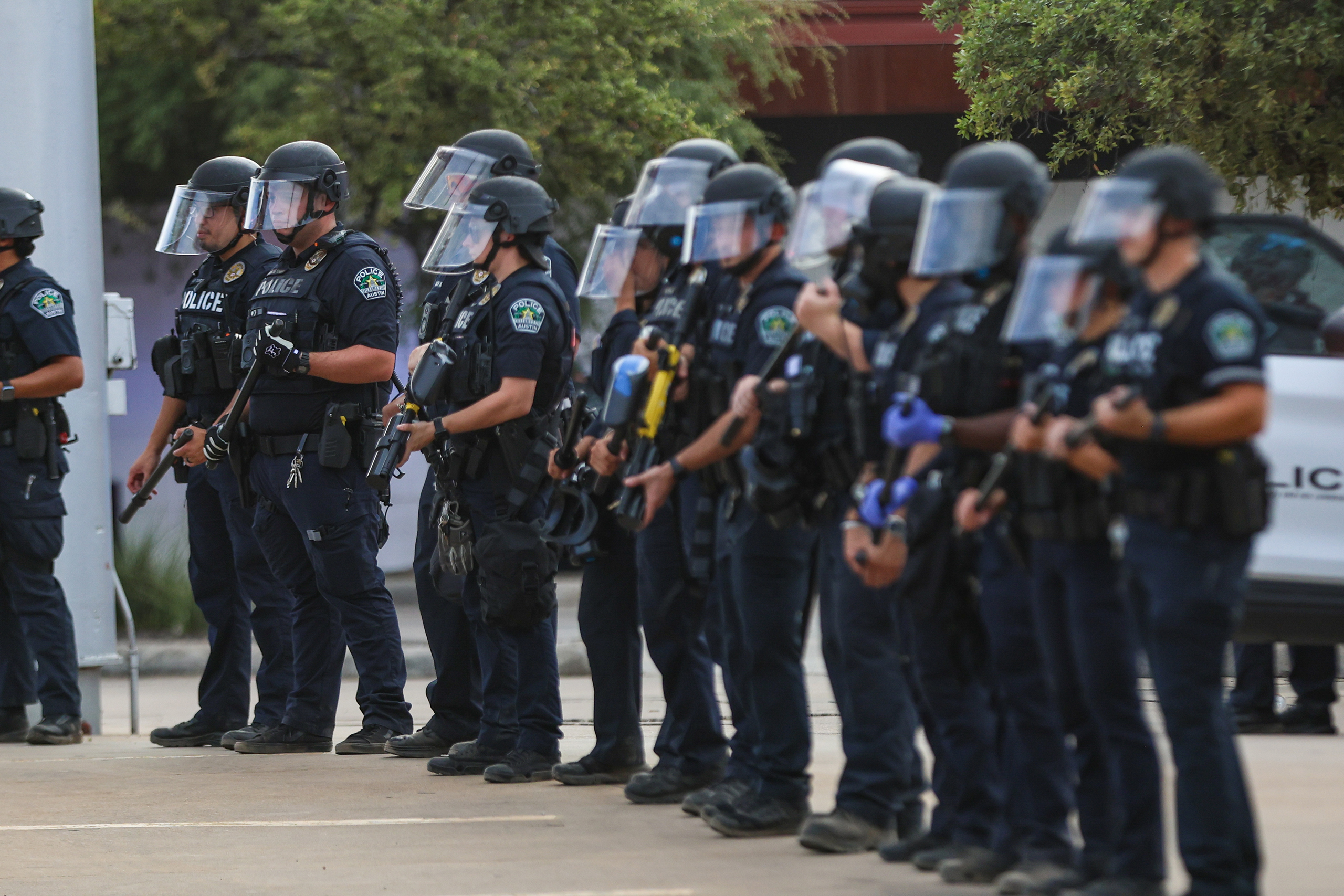 Austin police hold pepper ball guns as protestors confront officers after an immigration enforcement agent shot and injured Wilber Rafael Garces Perez, 28, of Venezuela, on Sunday Sept. 20, 2026.