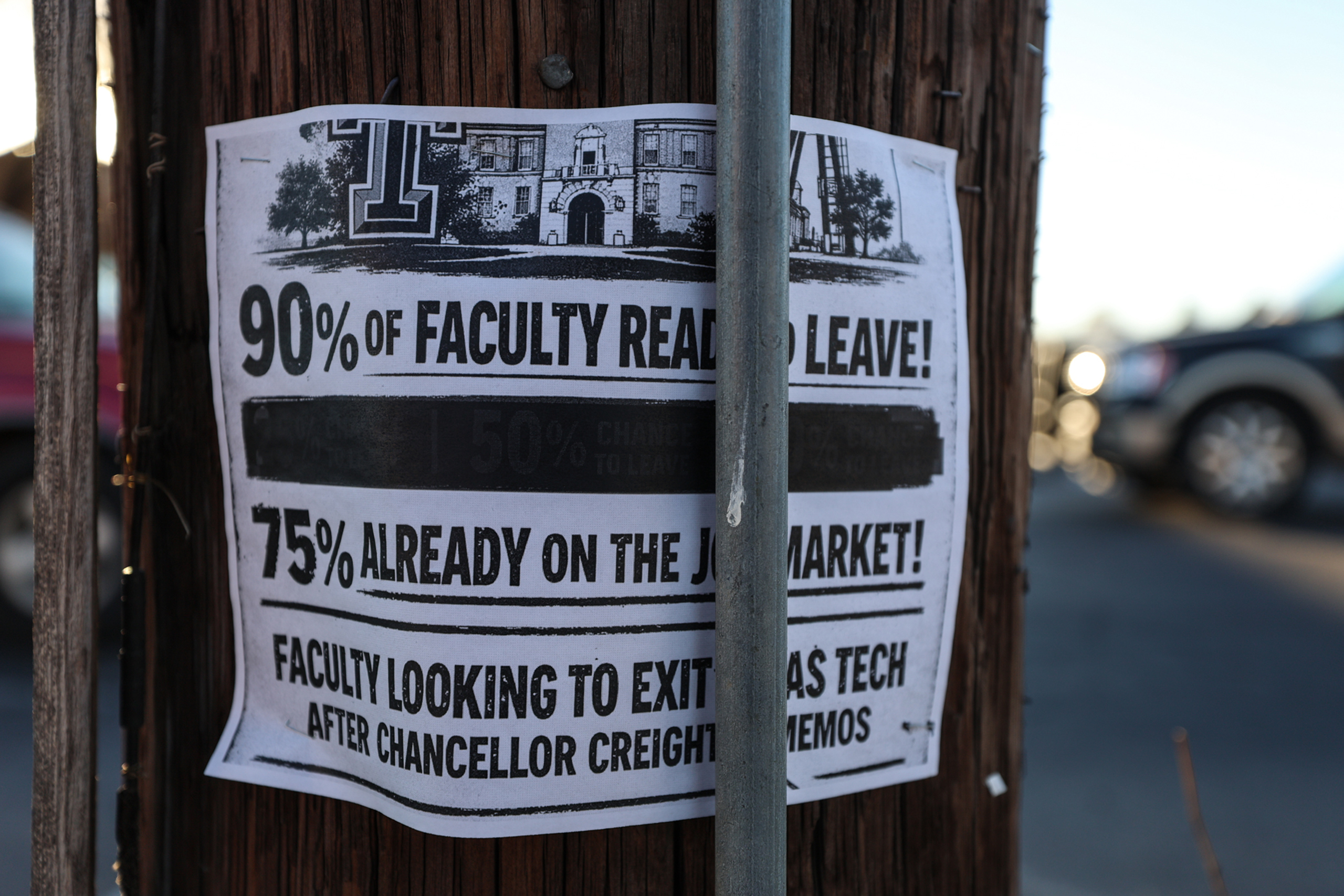 A sign is posted on a telephone pole out side J&B Coffee in Lubbock displays the amount of faculty ready to leave Texas Tech University after Tech System Chancellor Brandon Creighton mandated new changed to core curriculum.
